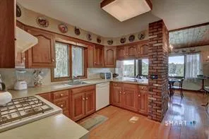 a kitchen with stainless steel appliances granite countertop a stove and a sink