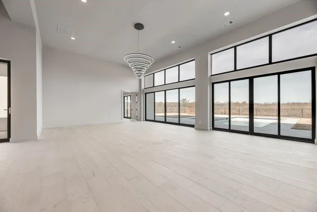 a view of an empty room with a large window