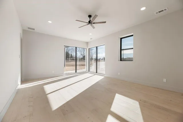 a view of an empty room with a window