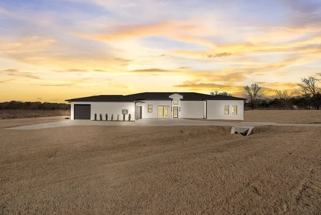 a view of a car parked in front of a building