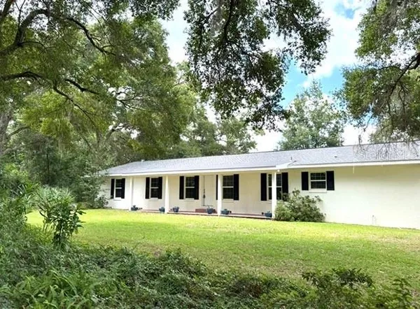 a outdoor view with a garden and trees