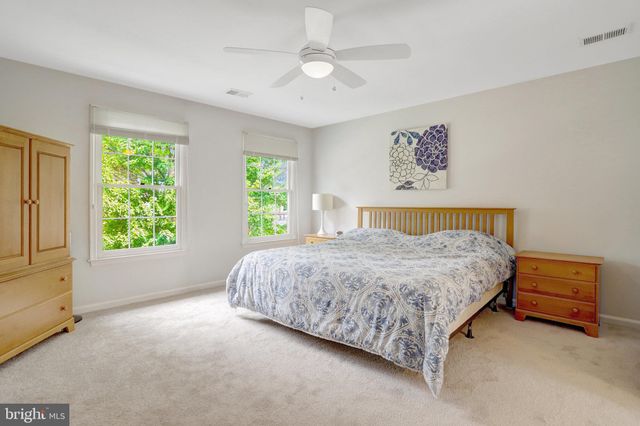 a bathroom with a sink vanity and a mirror