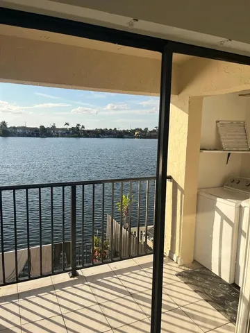 a view of a balcony with wooden floor and outdoor space