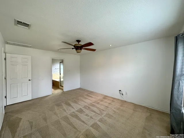 a view of a kitchen and a stove wooden floor kitchen view