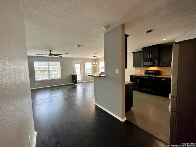 a view of an empty room with a window