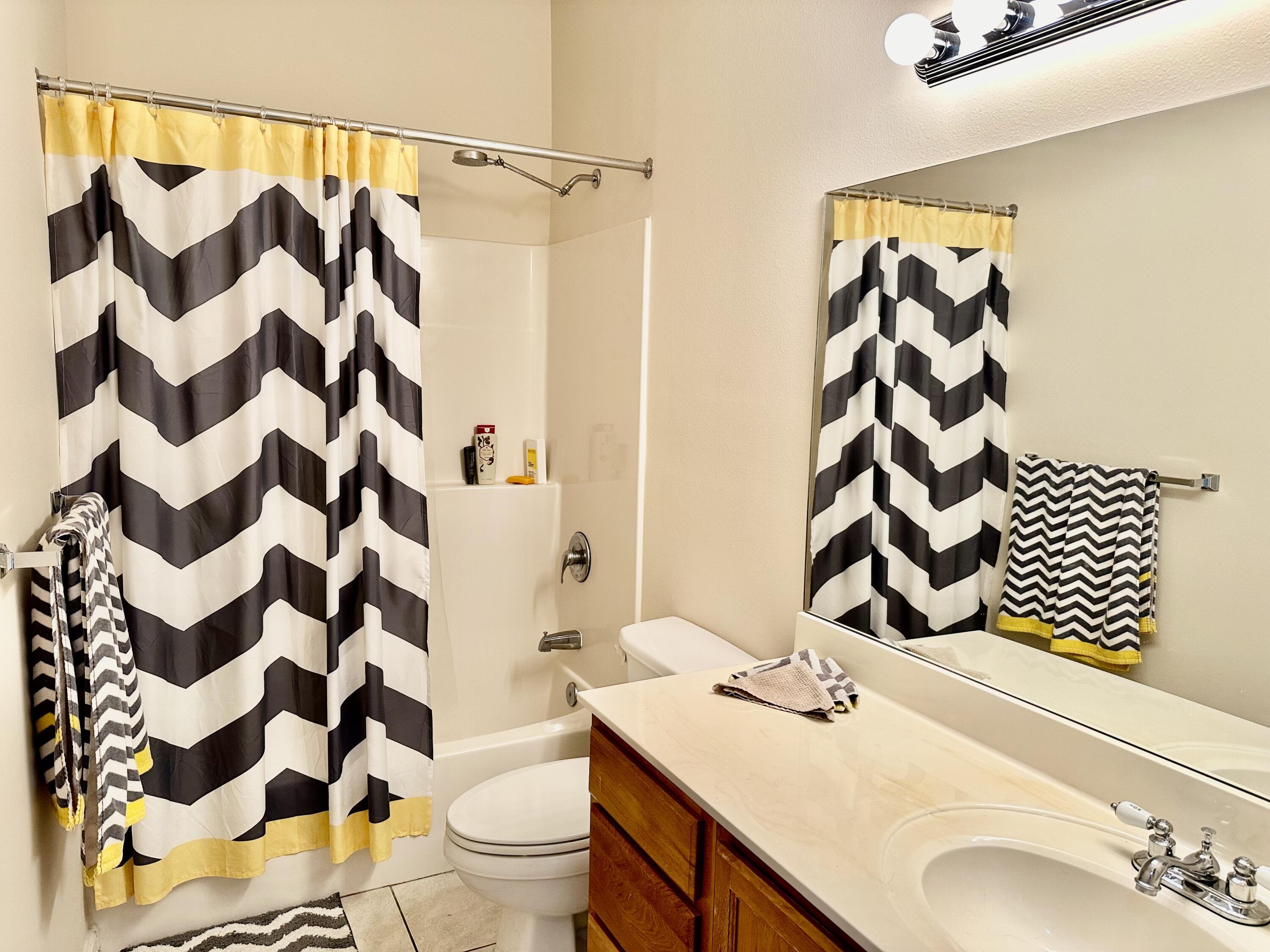 732 East Mack Bayou Drive, Unit 2 Santa Rosa Beach, FL 32459 - Photo 30 of 43 a bathroom with a sink and a mirror