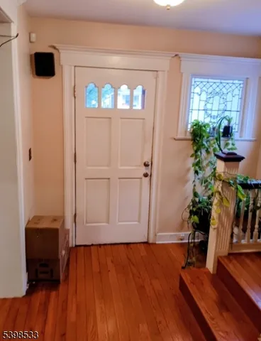 a view of entryway with wooden floor