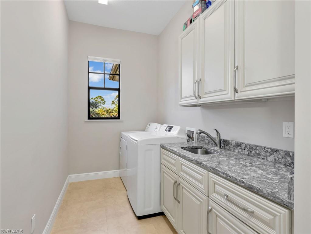 3160 27th Avenue Southwest Naples, FL 34117 - Photo 34 of 43 a kitchen with a sink and cabinets