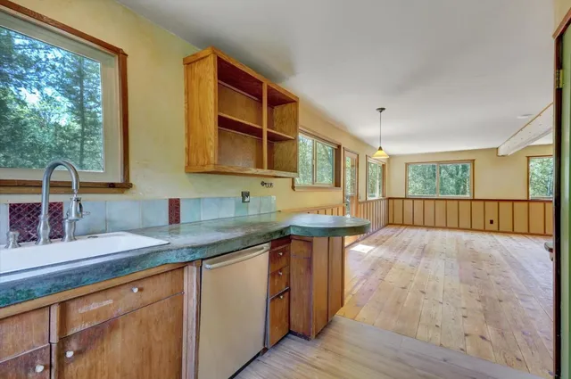 a bathroom with a glass door shower