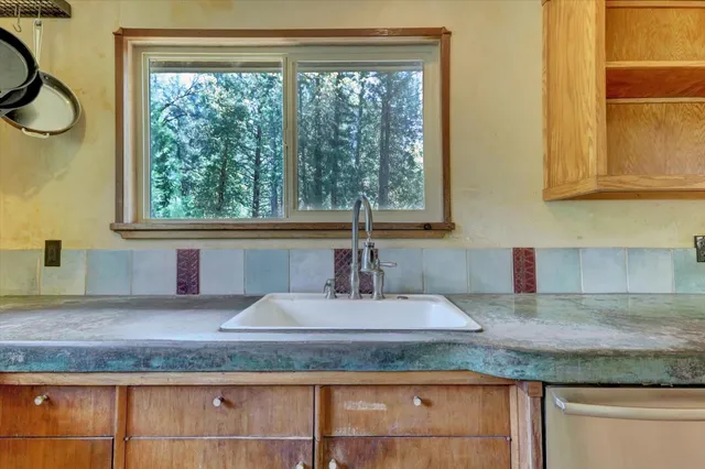 a spacious bedroom with a bed and large windows