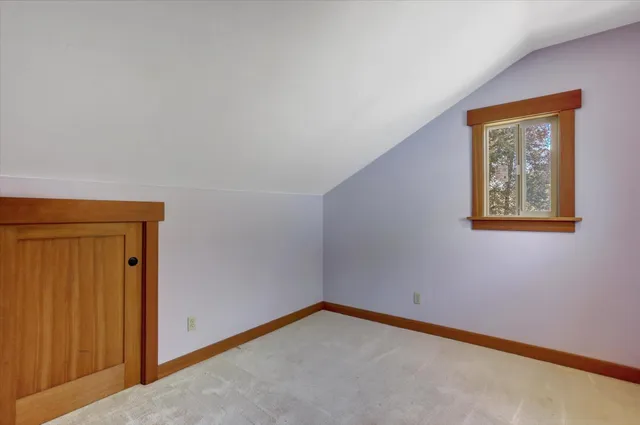 a backyard of a house with yard and outdoor seating