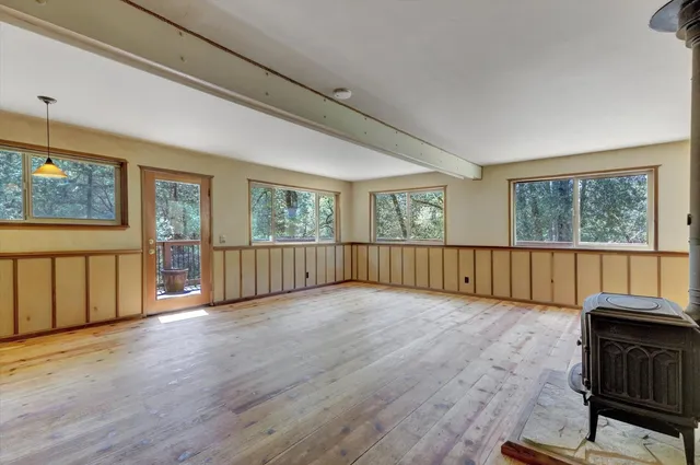 a kitchen with stainless steel appliances granite countertop a refrigerator and a stove