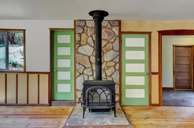a view of balcony with wooden floor and fence
