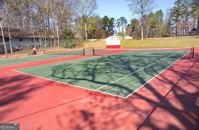 a view of swimming pool with an outdoor space and seating area