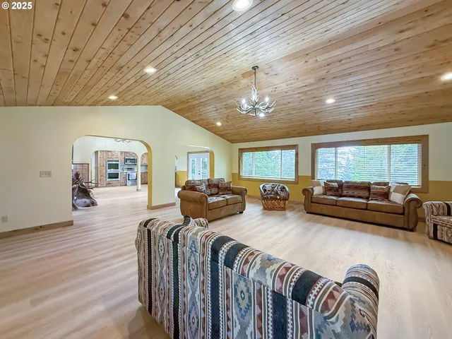 a spacious bedroom with furniture and a couch