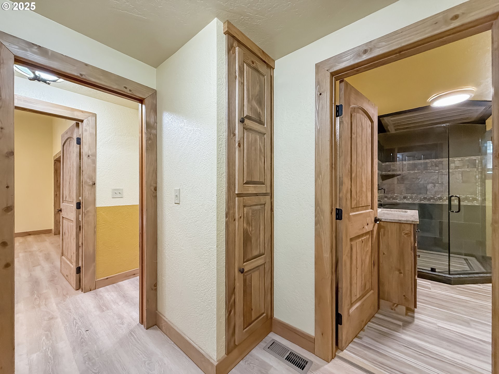 20313 Whaleshead Road Brookings, OR 97415 - Photo 23 of 41 a view of a hallway with wooden floor and staircase