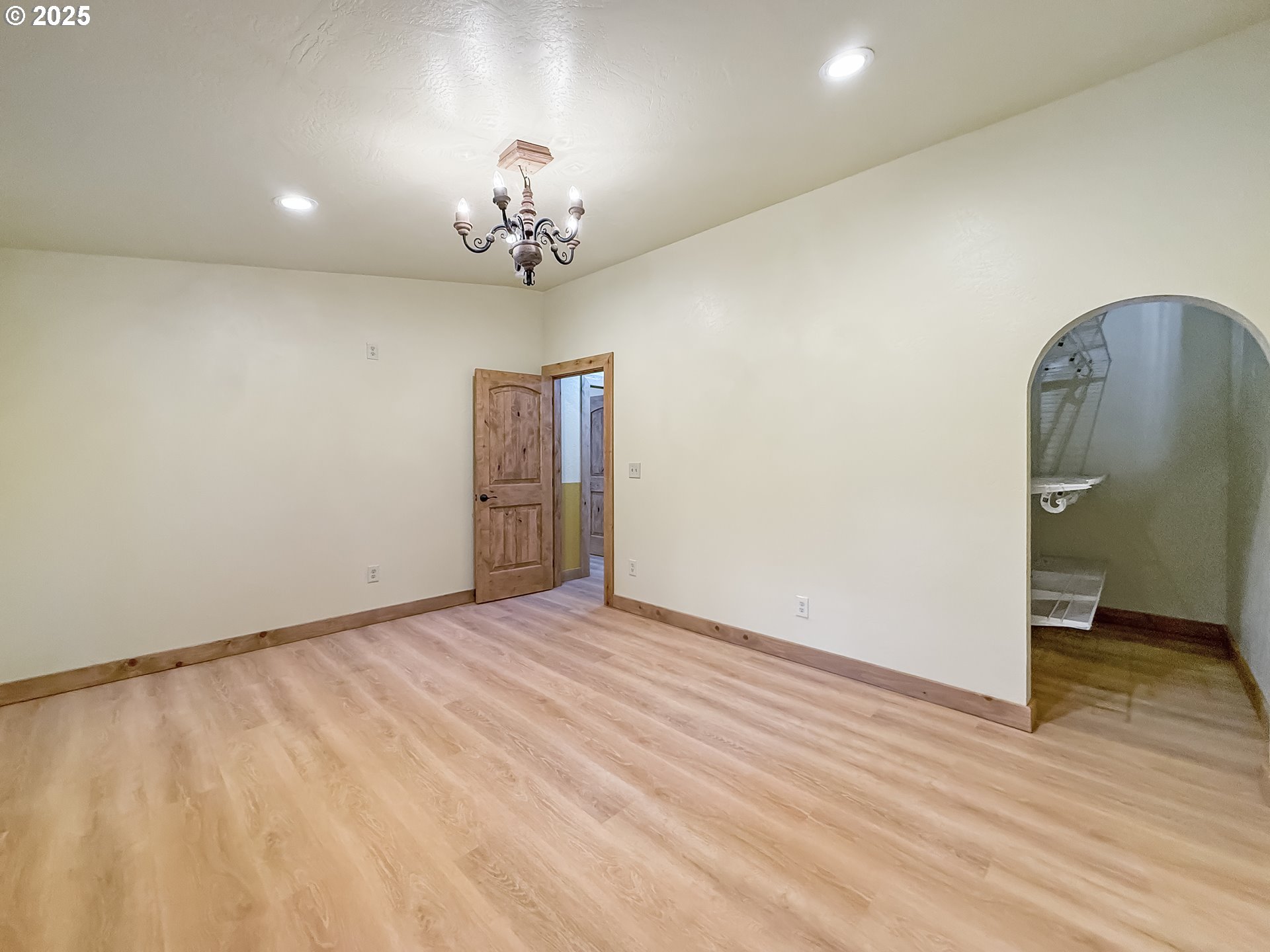 20313 Whaleshead Road Brookings, OR 97415 - Photo 26 of 41 a view of an empty room with wooden floor