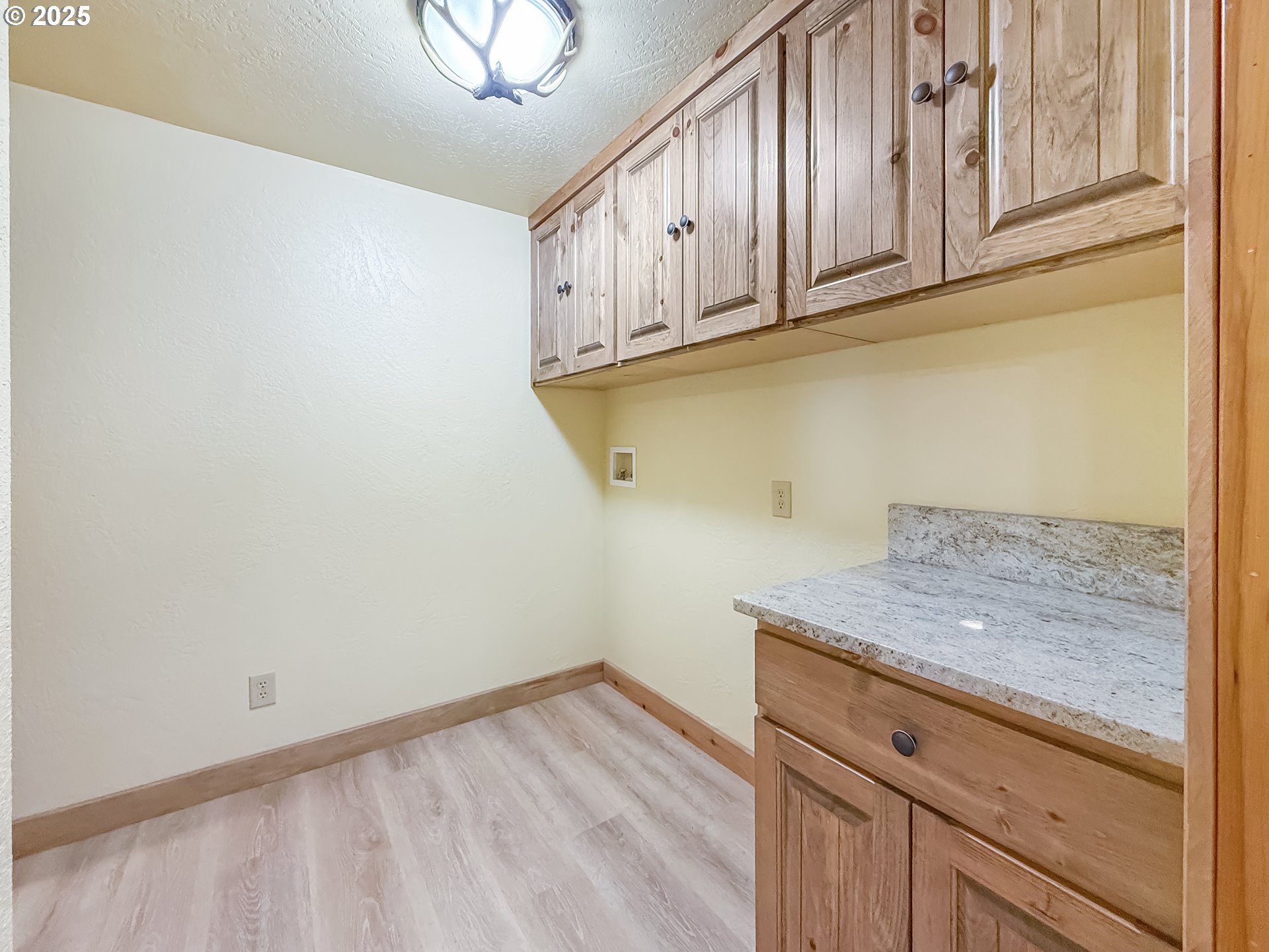 20313 Whaleshead Road Brookings, OR 97415 - Photo 30 of 41 a view of a kitchen with granite countertop cabinets