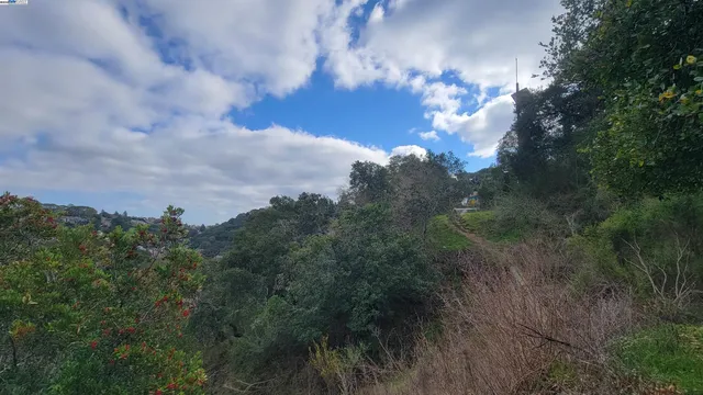 a picture of a room with a white bed and a window