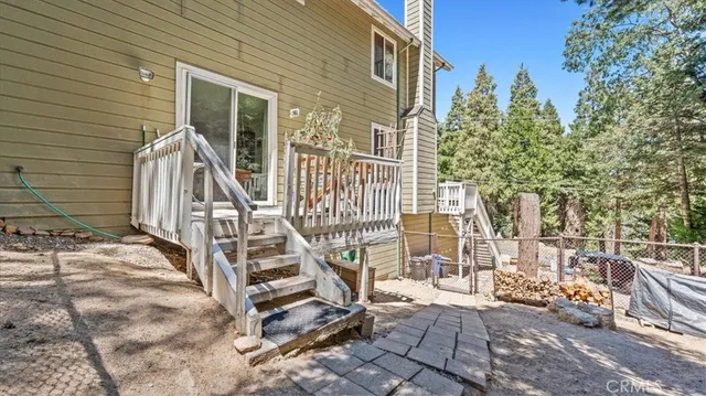 a house with a bench next to a yard