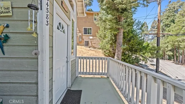 a view of a balcony with wooden floor