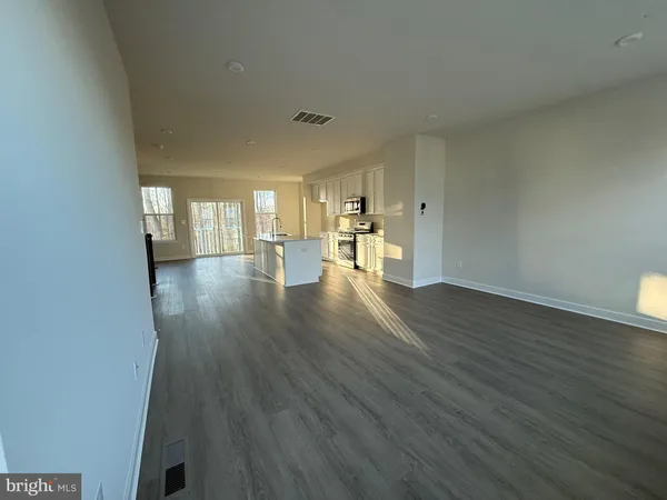 a view of a livingroom with wooden floor