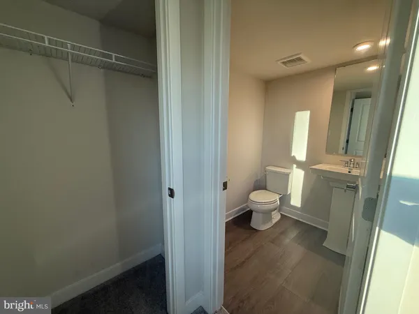 a bathroom with a toilet sink and a shower