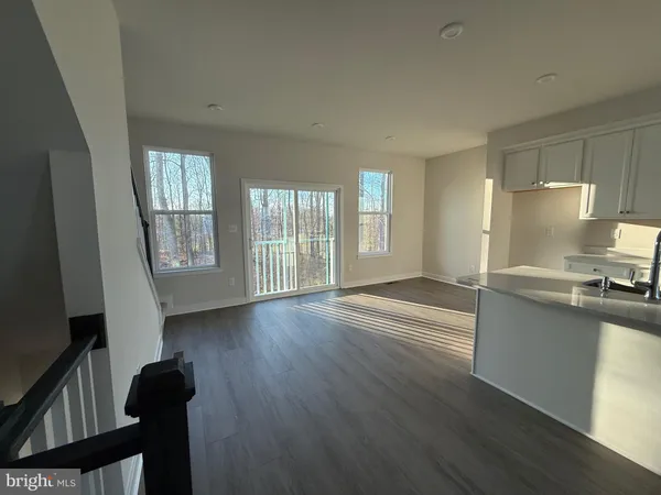a view of a kitchen cabinets and wooden floor