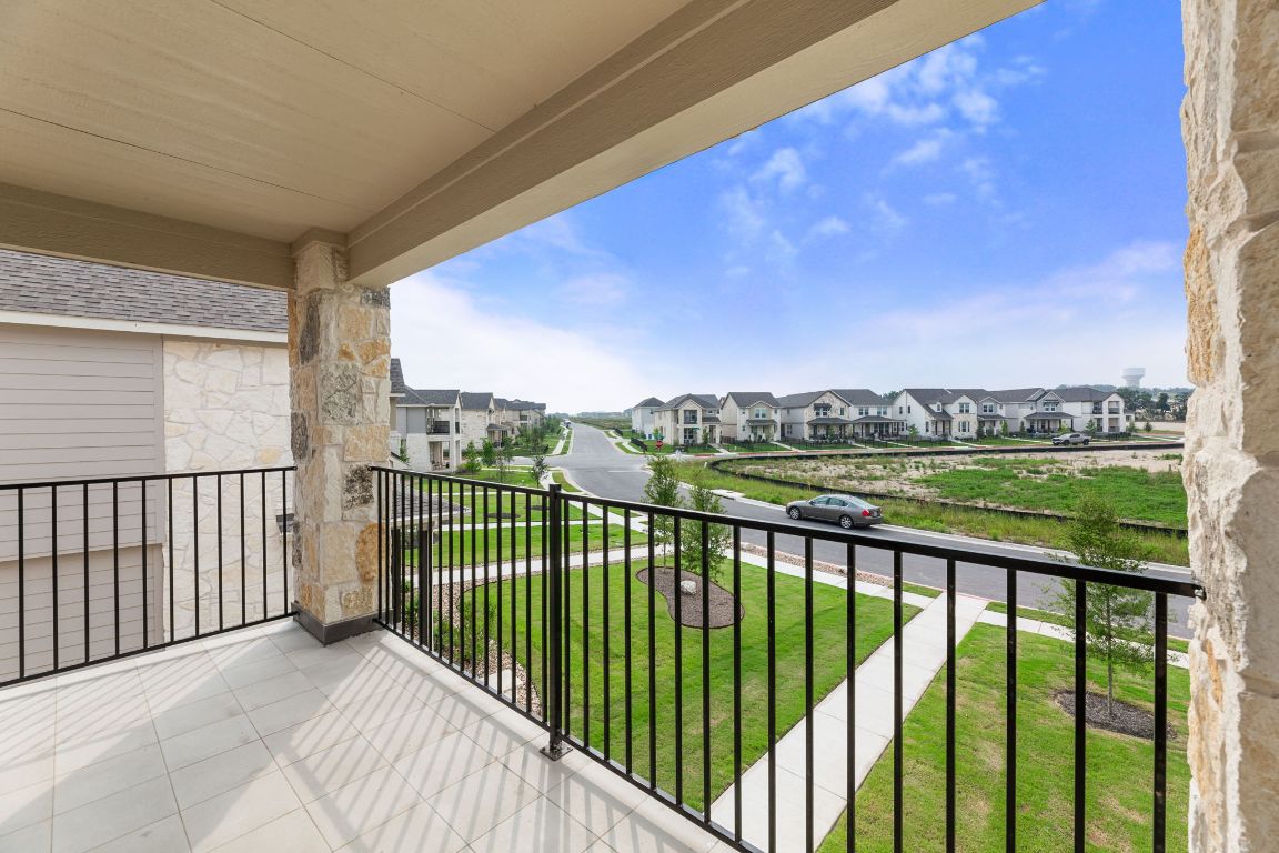 354 Lost Mine Peak Lane Dripping Springs, TX 78620 - Photo 2 of 26 Talk about a great spot for unwinding! This balcony is off the main bedroom.