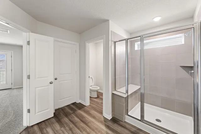 a bathroom with a glass shower door