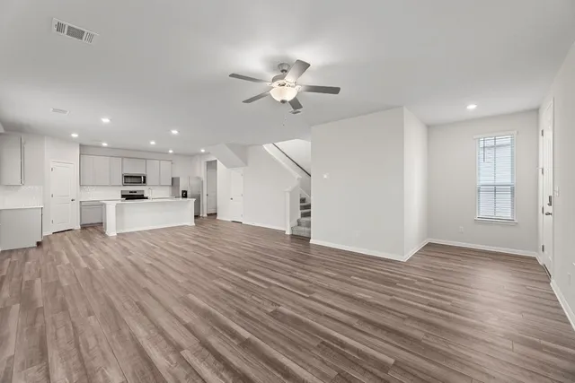 a view of kitchen with cabinets and wooden floor