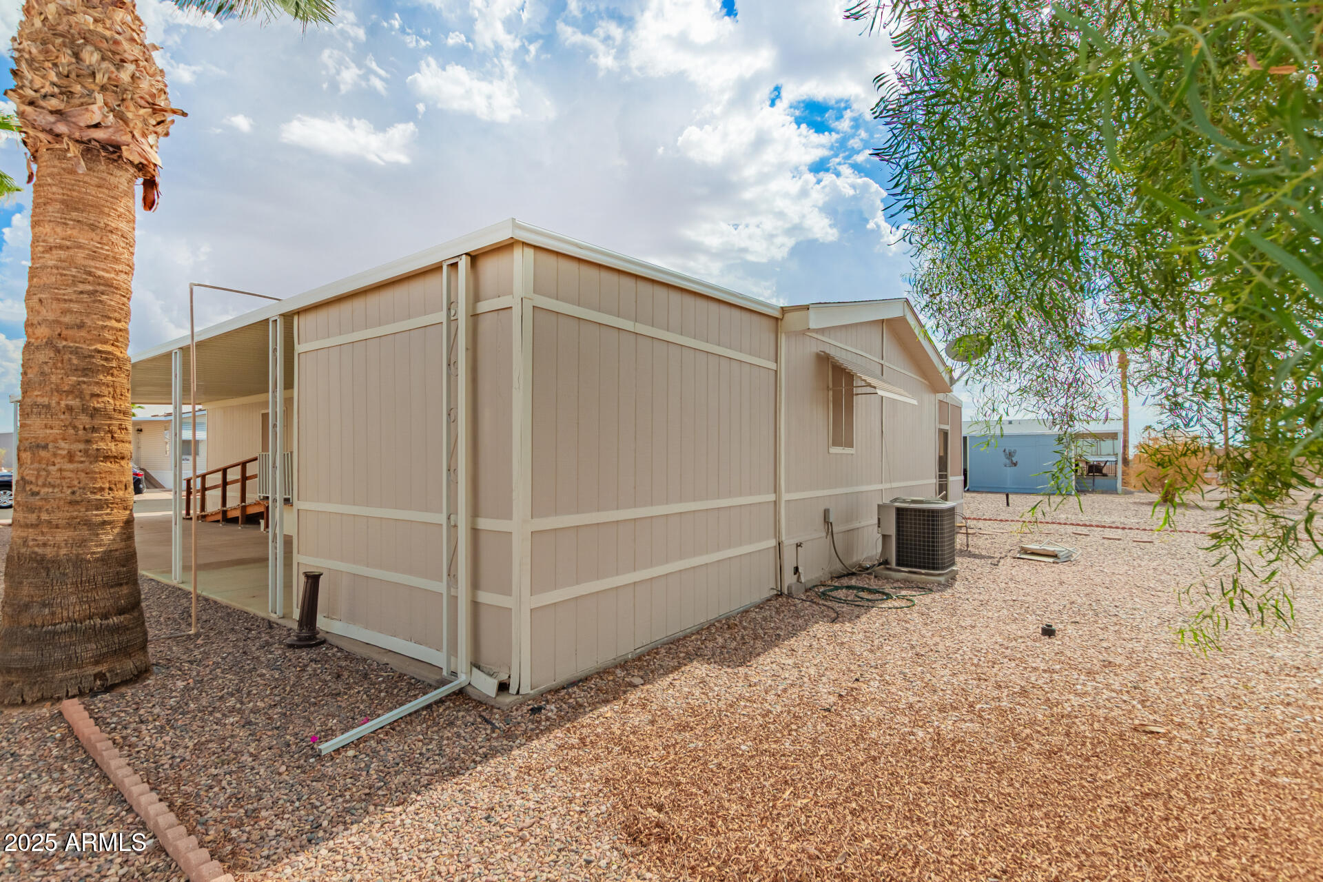 301 South Signal Butte Road, Unit 706 Apache Junction, AZ 85120 - Photo 37 of 51 a view of a house with a yard