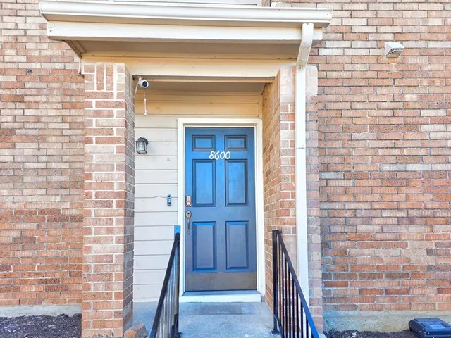 a view of entryway with a wooden door
