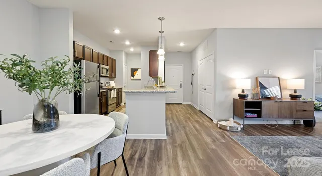 a kitchen with sink and refrigerator