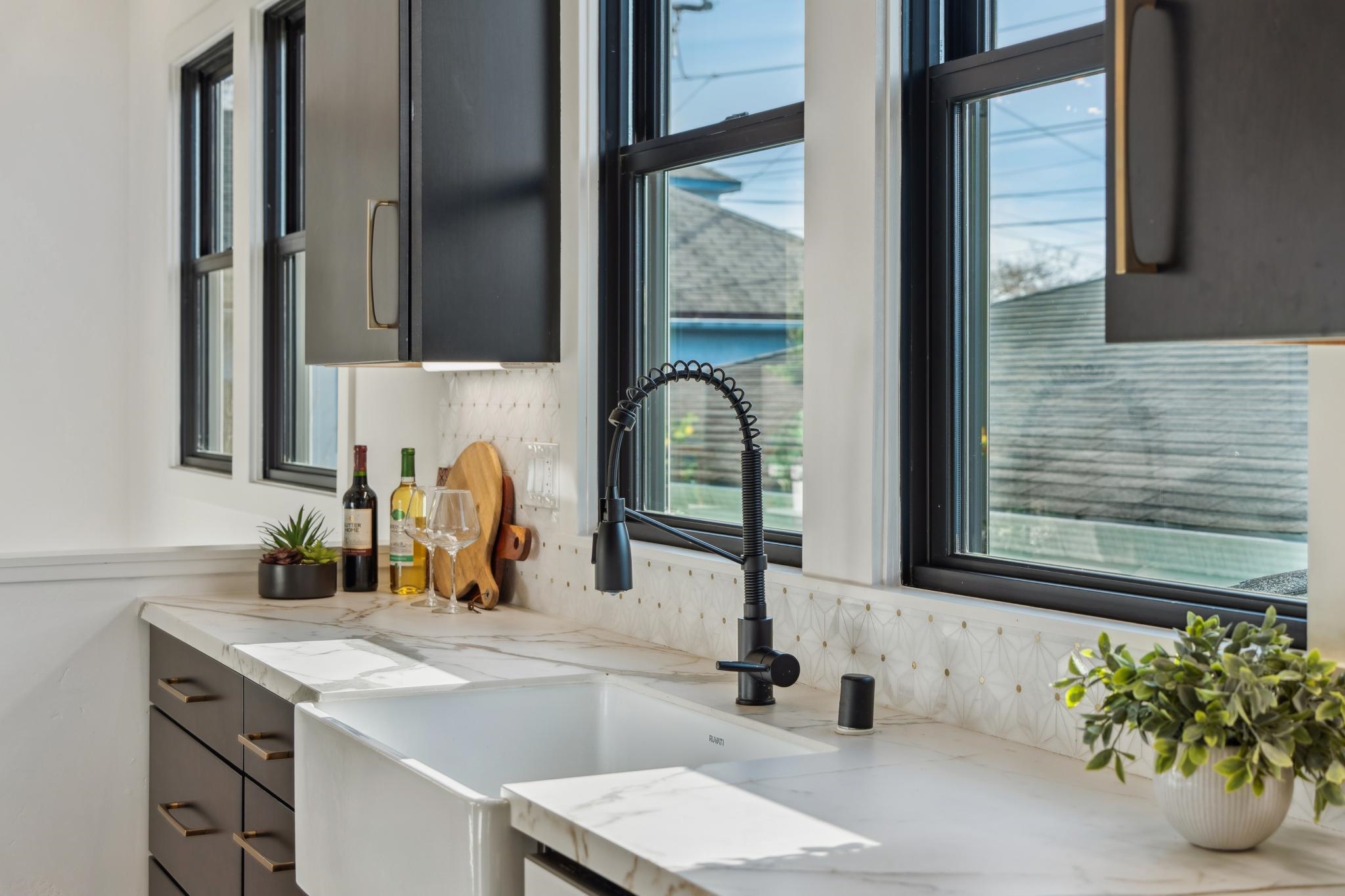 1308 Court Street Alameda, CA 94501 - Photo 25 of 60 Kitchen with light stone counters and gray cabinetry