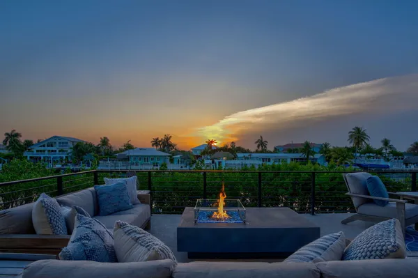 a outdoor living room with furniture and a garden
