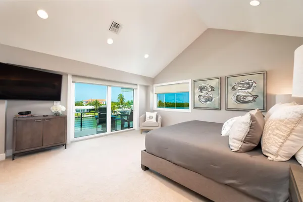 a bedroom with bed and window