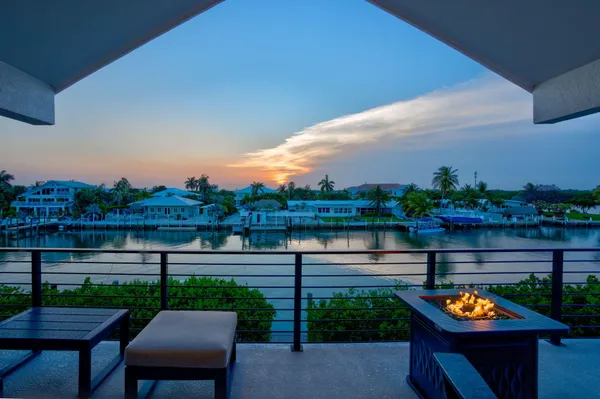 a bedroom with a bed and a potted plant