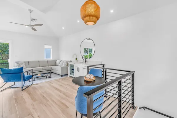 a swimming pool with outdoor seating