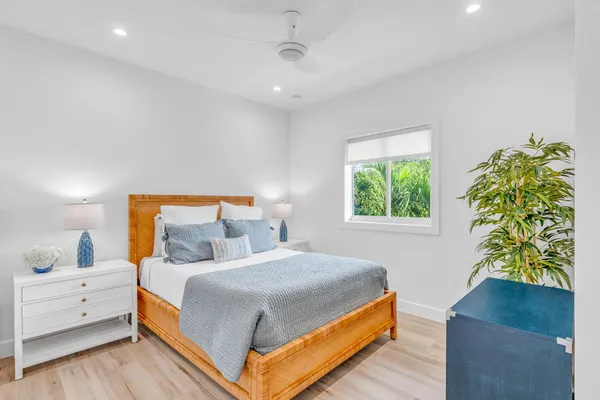 an aerial view of a house with a garden and swimming pool