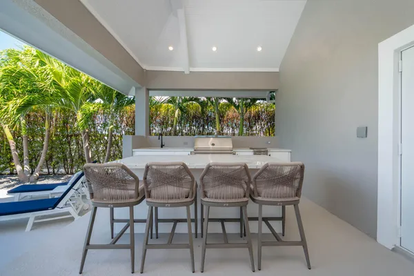 a picture of a room with a white wall and a refrigerator