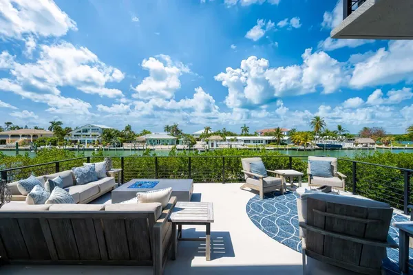 a view of a patio with couches chairs and a table