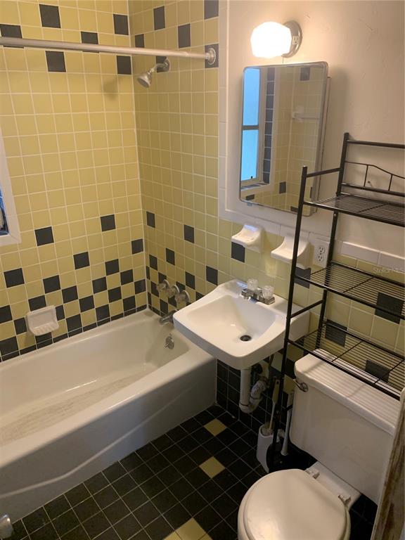 1063 40th Street Sarasota, FL 34234 - Photo 12 of 13 a bathroom with a sink and a mirror