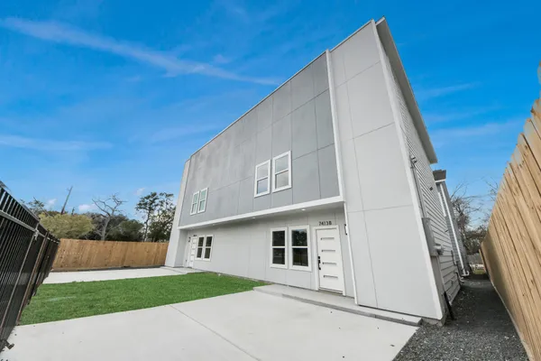 a backyard of a house with lots of green space