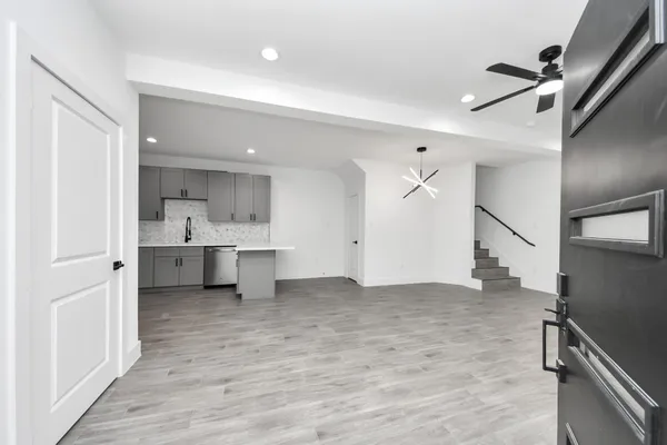 a kitchen with a sink stove and microwave
