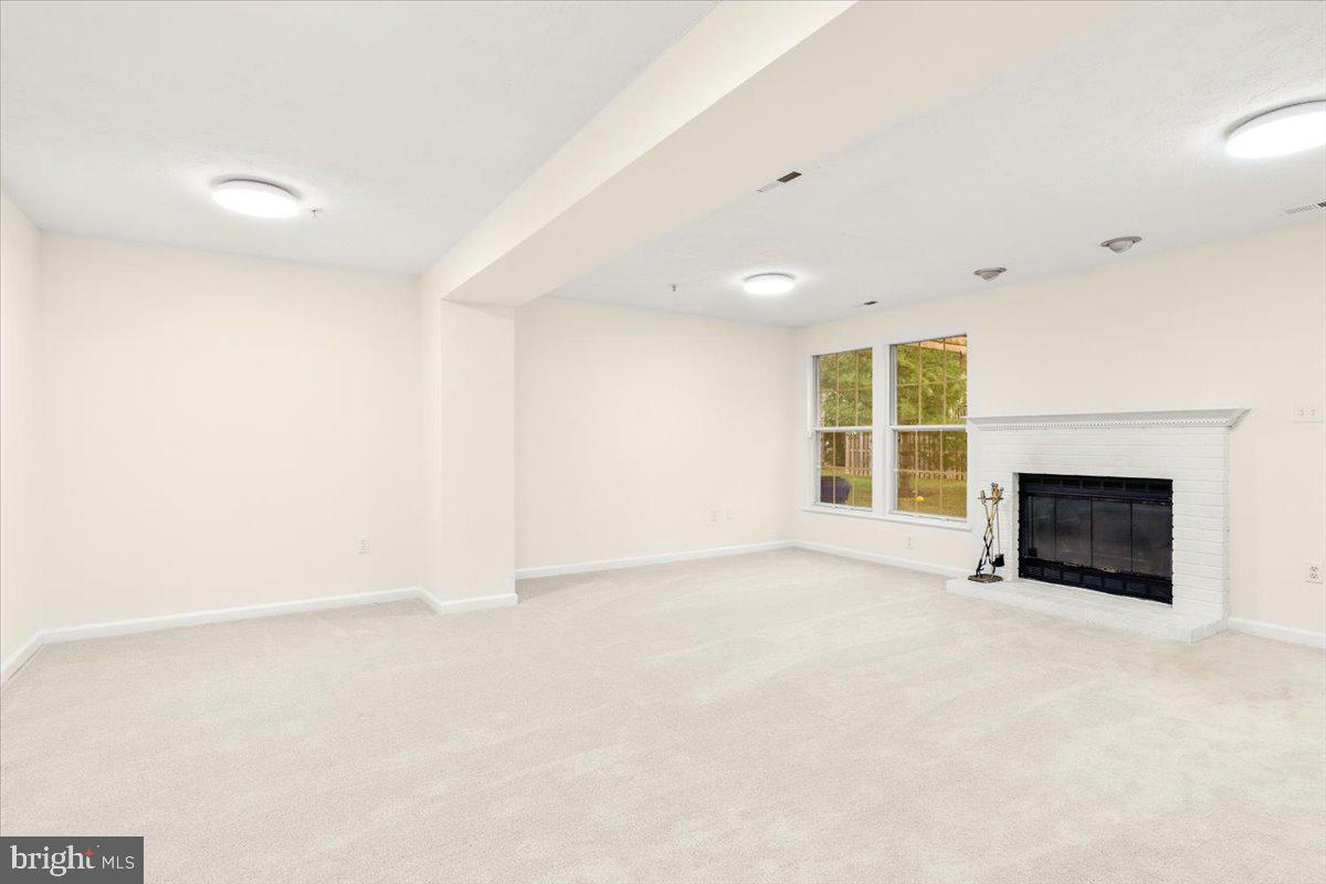 6570 Ellington Way Frederick, MD 21703 - Photo 32 of 39 Lower level w/ fireplace