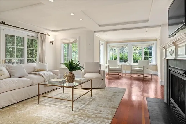 a view of a dining room with furniture and front door