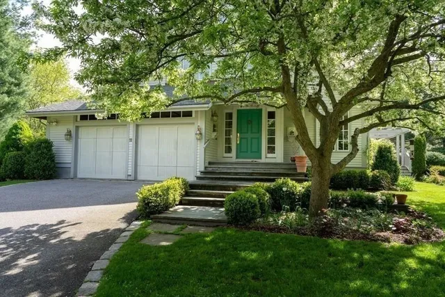 a front view of a house with garden