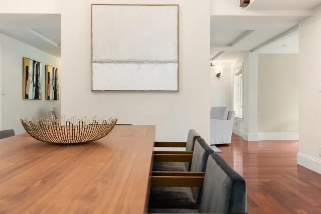 a view of a livingroom with furniture and wooden floor