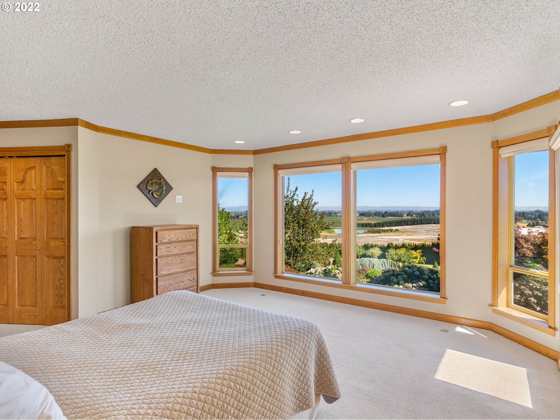 38000 Southwest Nursery Road Cornelius, OR 97113 - Photo 16 of 40 a bedroom with a bed and large windows